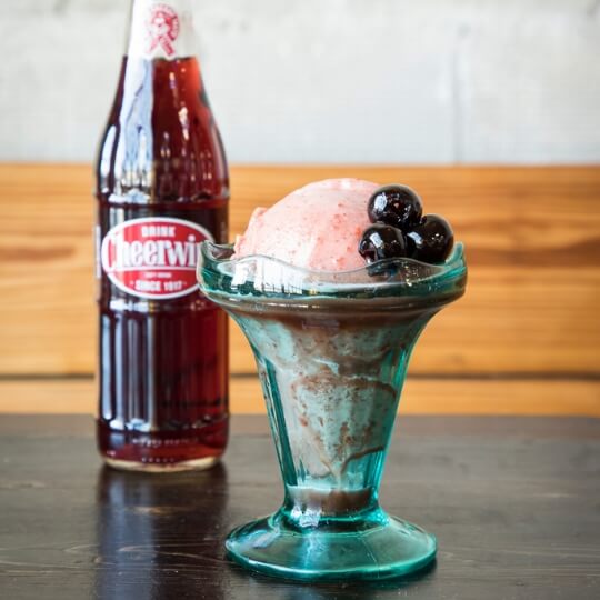 Q32026-right Cheerwine glass bottle next to an ice cream sundae